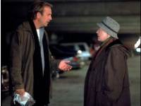 
 Kevin Costner receives some
 sane advice from Cathy Bates.  
  .  
